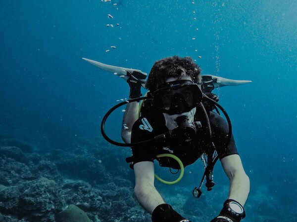 Diver learning perfect buoyancy during PADI advanced open water course.